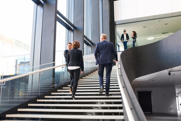 a group of people walking up stairs