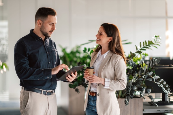 a person and person standing in front of plants
