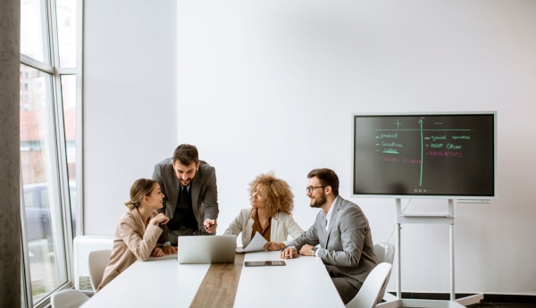 a group of people sitting around a table